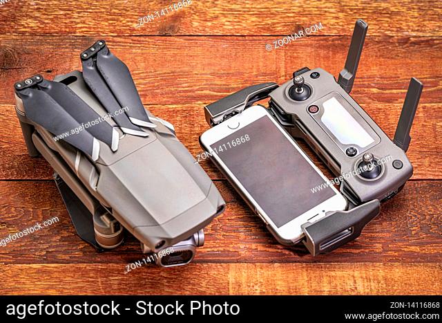 Fort Collins, CO, USA - January 18, 2019: DJI Mavic 2 pro with Hasselblad camera and radio controller against rustic wood - an advanced prosumer folding drone