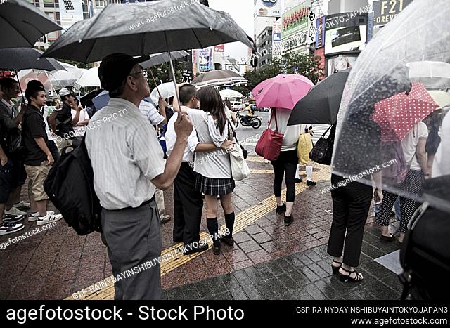 Rainy day in the Shibuya district, Tokyo. Shibuya is famous for one of the fashion centers of Japan for young people and as a major nightlife area