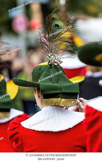 Headwear, brimmed hat, peacock feather, white ruff on red women's costume, Oktoberfest, Munich, Upper Bavaria, Bavaria, Germany
