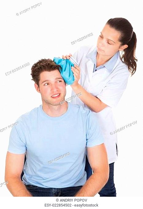 Doctor Giving Treatment To Patient