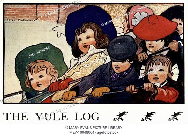 A group of children pull in the yule log
