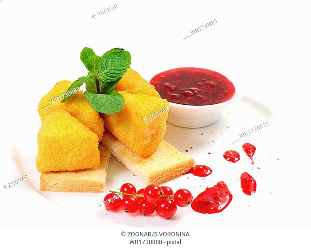 Cheese in breadcrumbs with currant jam