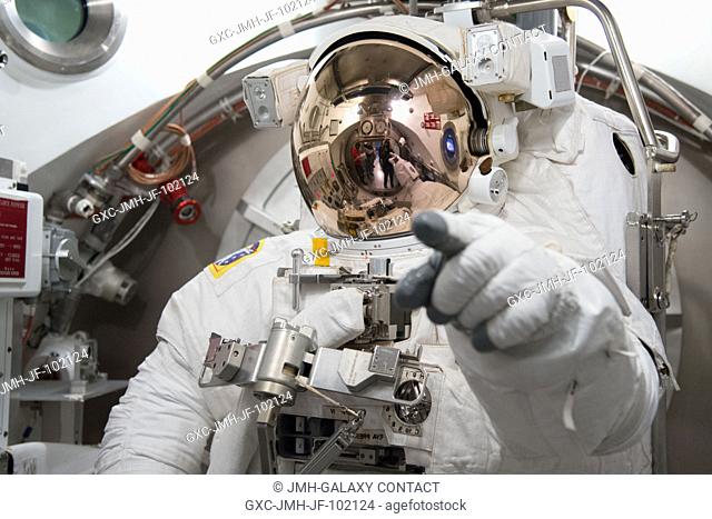 European Space Agency astronaut Luca Parmitano, Expedition 3637 flight engineer, participates in an Extravehicular Mobility Unit (EMU) spacesuit fit check in...