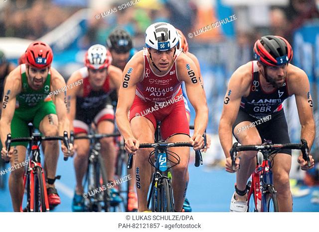 Lukas Hollaus (Austria, C), Adam Bowden (Great Britain, R) cycling in the 7th station of the men's triathlon at the World Triathlon Series in Hamburg,  Germany
