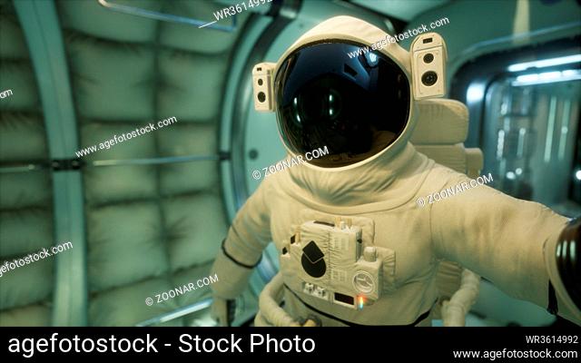 astronaut inside the orbital space station. Elements of this image furnished by NASA