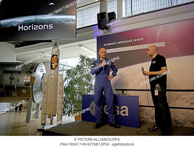 17 April 2018, Cologne, Germany: Alexander Gerst (C), astronaut, speaking at a press conference. ""Astro Alex"" is speaking about the work programme and the...