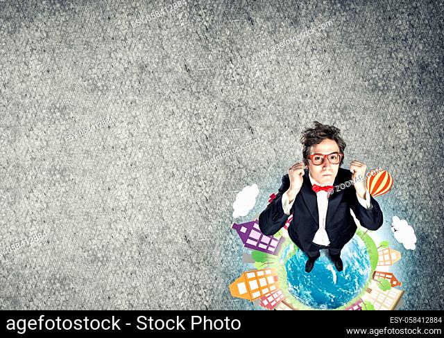 Top view of funny businessman in red glasses celebrating success. Elements of this image are furnished by NASA