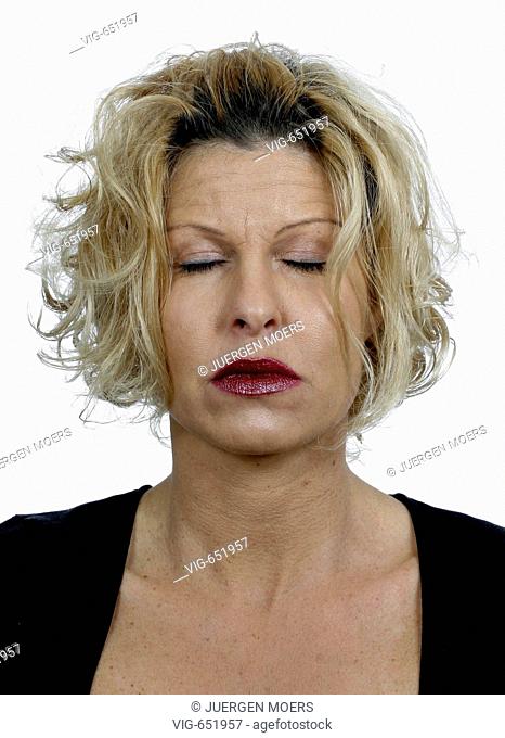 Portrait of a young woman with closed eyes. - DORSTEN, NORTH RHINE-WESTPHALIA, GERMANY, 25/02/2008