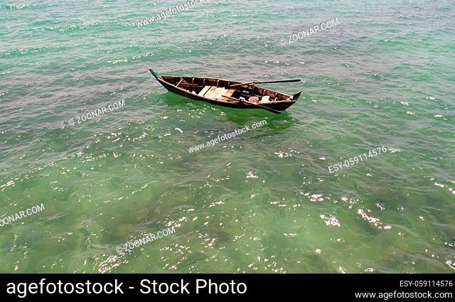 Aerial view of fisherman boat floating on the sea