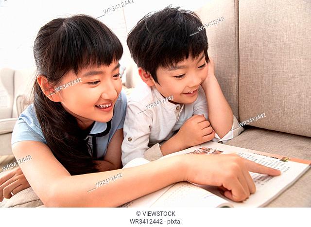 Siblings, two people reading