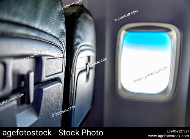 seat and window in an airplane during a flight