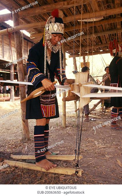 Akha woman weaving cloth on an Akha loom