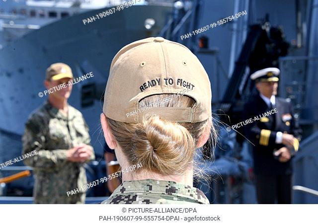 07 June 2019, Schleswig-Holstein, Kiel: With ""Ready to Fight"" printed on her cap, a US Navy female soldier stands at the start of the Baltic Operations...