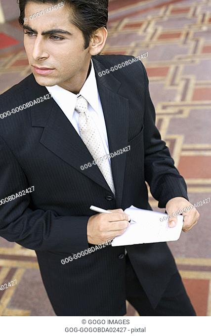 Businessman taking notes