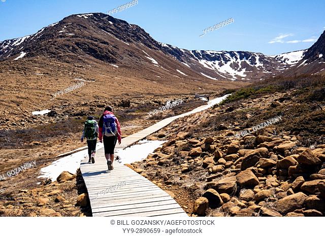Hikers in the Tablelands, Gros Morne National Park, near Woody Point, Newfoundland, Canada