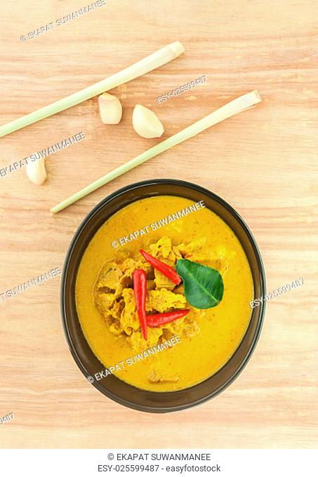 Curry pine apple with pork on wooden background, Food rainy season, Curry hot spicy is original curry in south Thailand