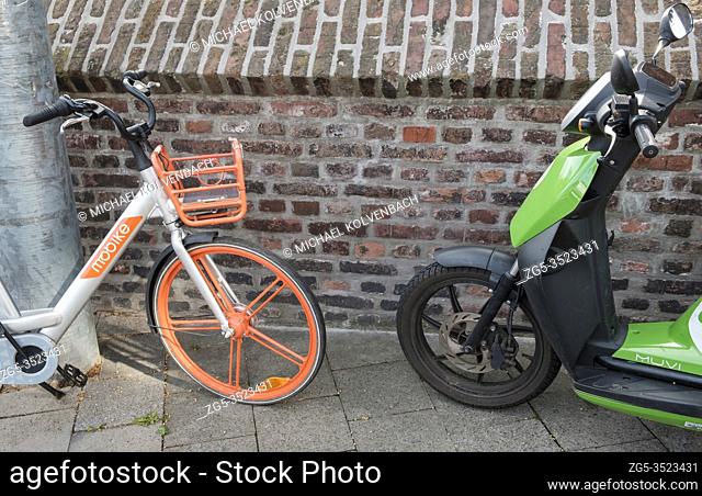 Duesseldorf, Northrhine-Westpalia, Germany, 19. 8. 2019, rental bike from the company Mobike and electric scooter from the rental company Eddy