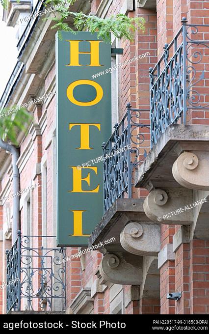 16 May 2022, Saxony, Dresden: A sign reading ""Hotel"" hangs at the entrance to a house. The Federal Constitutional Court publishes its decision on the...