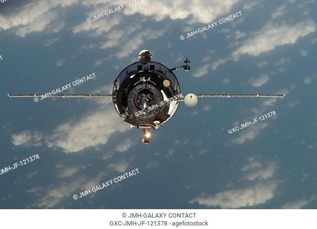 Backdropped by a blue and white Earth, an unpiloted Progress supply vehicle approaches the International Space Station. Progress 28 resupply craft launched at...