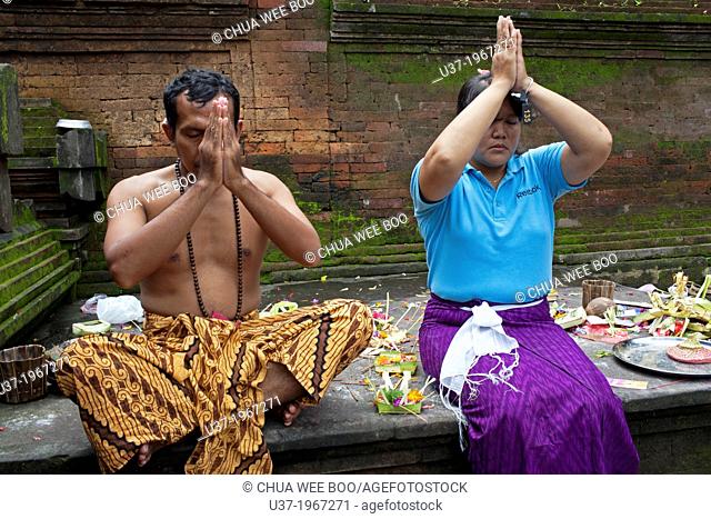 Praying before entering the Tirta Empul The Holy Spring, Tampaksiring, Bali