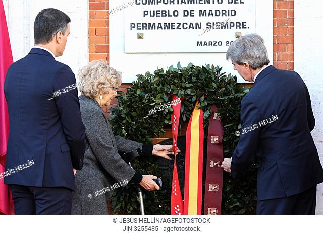Angel Garrido(R), Pedro Sanchez(L) and Manuela Carmena(C) seen carrying the floral offering in the event of tribute to the victims of the 11M