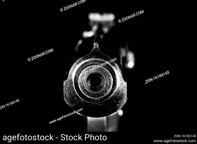 Gun barrel close up on black background.Shooting weapon