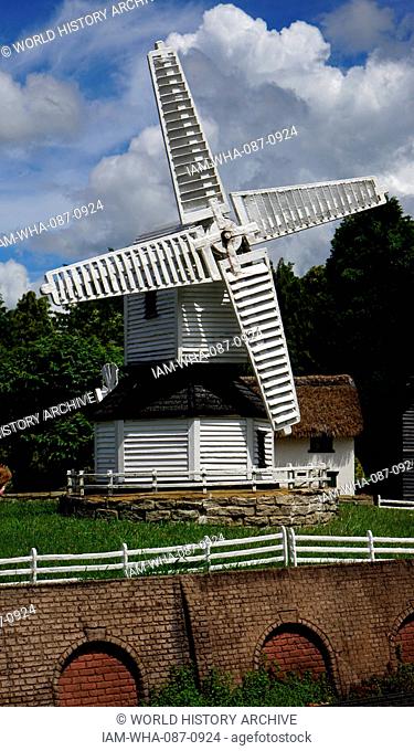 Village windmill at Bekonscot in Beaconsfield, Buckinghamshire, England, the oldest original model village in the world. It portrays aspects of England mostly...