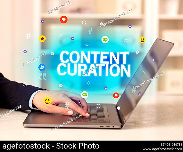 Freelance woman using laptop with CONTENT CURATION inscription, Social media concept