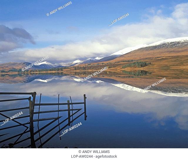 Scotland, Argyll & Bute, Loch Tulla, Snow capped mountains reflected in the still water of Loch Tulla