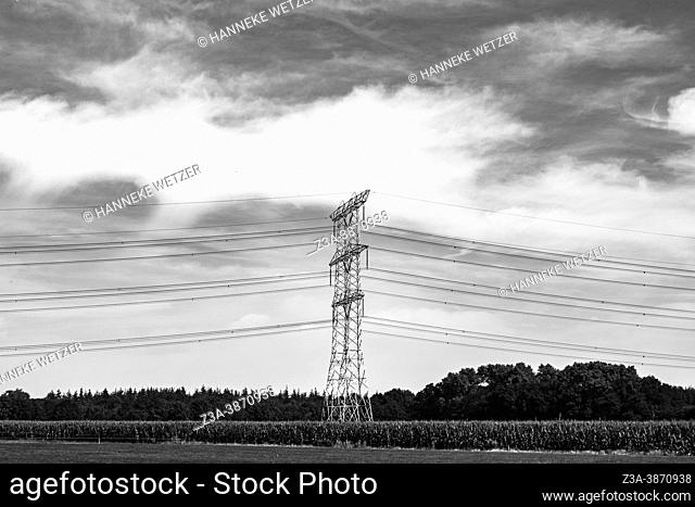 A transmission tower, also known as an electricity pylon, in a Dutch landscape