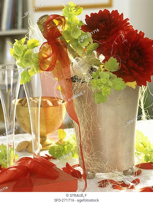 Champagne cooler with champagne bottle, Bells of Ireland & dahlias