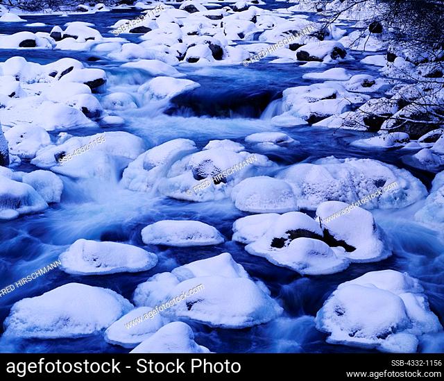 Snow-capped boulders along the Little Susitna River, winter freeze-up in the Talkeetna Mountains, Alaska