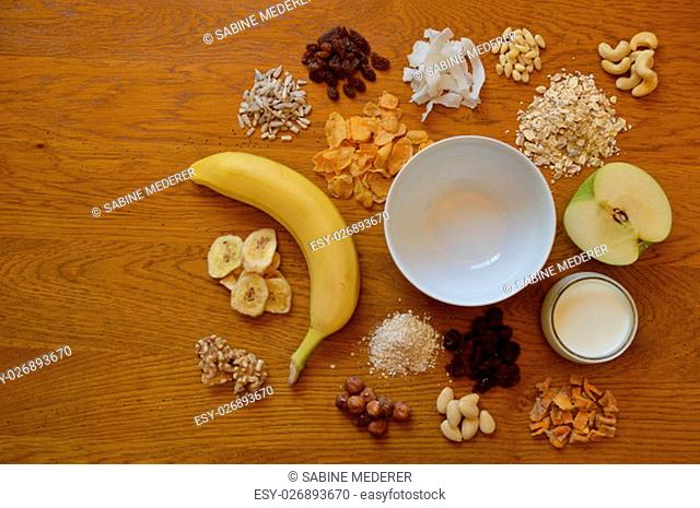 cereal bowl on the breakfast table with individual components of a cereal thereabout