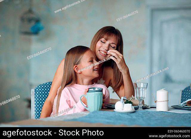 Mother and little daughter child girl at home. Single parenting and motherhood