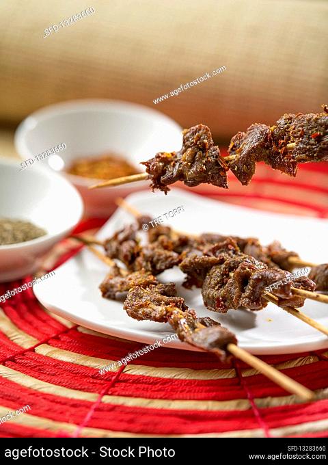 Chinese lamb skewers with sambal oelek, soy sauce and chilli flakes