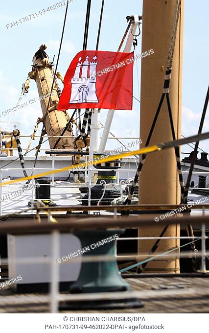 A Hamburg flag can be seen on the museum ship 'Peking' (lit. Beijing) at the transport ship 'Combi Dock III' in Brunsbuettel,  Germany, 31 July 2017