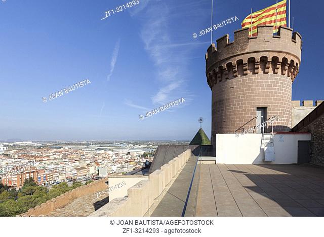 Castle of Castelldefels, tower, catalan flag and city view, province Barcelona, Catalonia. Spain