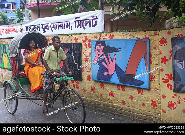 In protest against rape and violence against women, an exceptional exhibition of paintings titled ""Jago Nari Jago Bahi Shikha"" was organized in the Puja...