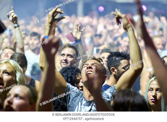 party crowd cheering at DJ Afrojack at music festival Starbeach in Hersonissos, Crete, Greece, on 02. August 2017