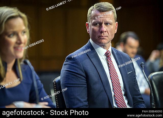 Michigan D. Michael Hurst, Jr., former United States Attorney, Southern District of Mississippi, right, listens while Jocelyn Benson, Secretary of State