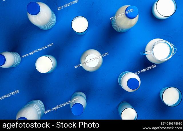 Collection of bottles and glasses with milk and different dairy products on blue background, top view, flat lay