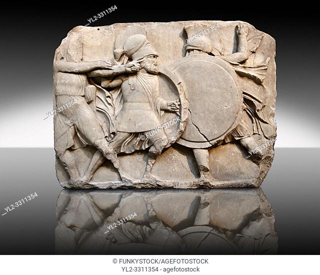 Two warriors clasing shields on a freeze from the Large Podium of the sculptured 4th cent. B. C Lycian Nereid ( Mythical Greek Sea Nymphs) Monument tomb of...