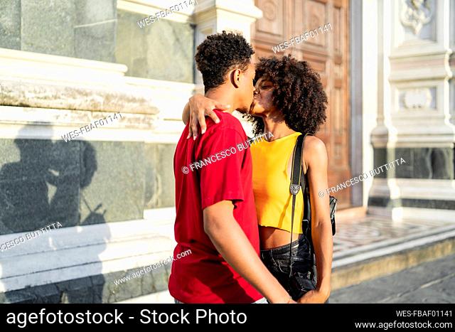 Young couple kissing in the city, Florence, Italy