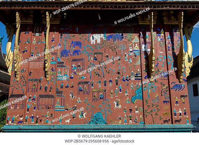 Some of the exterior walls of the buildings at the Wat Xieng Thong in the UNESCO world heritage town of Luang Prabang in Central Laos contain colorful mosaics