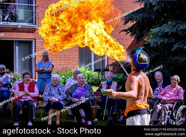 17 June 2020, Mecklenburg-Western Pomerania, Gadebusch: Fire-breather Adriano Lauenburger from the Circus Royal during a small performance in a retirement home...