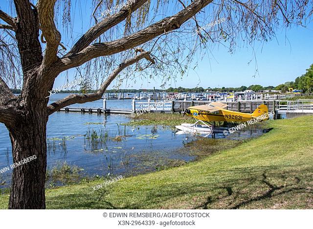 A docked Piper seaplane is left waiting for action in Tavares Florida USA