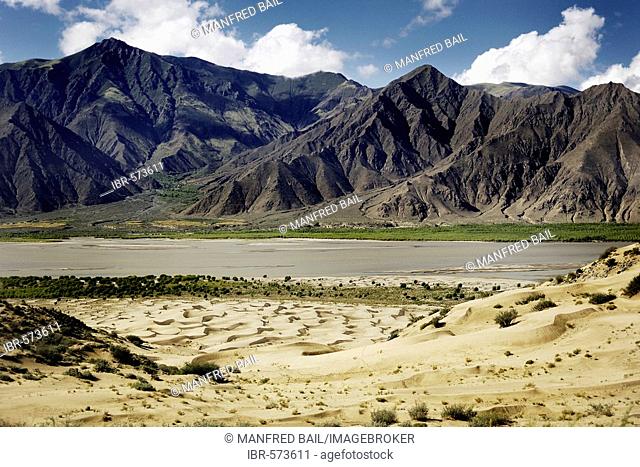 Mountains and dunes at the Brahmaputra River near Lhasa, Tibet, Asia