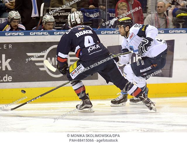 Berlin's Alex Roach (L) and Ingolstadt's Brett Bulmer in action during the DEL ice hockey match between Berlin Polar Bears and ERC Ingolstadt in the...