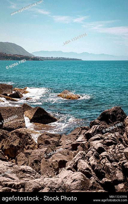 Stones, shore, sea, Cefalu, Sicily, Italy