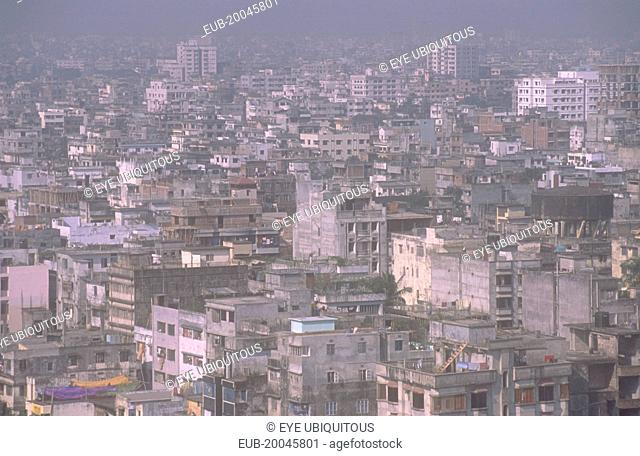 Elevated view over city architecture with high rise buildings in a densely populated area of Dhaka city